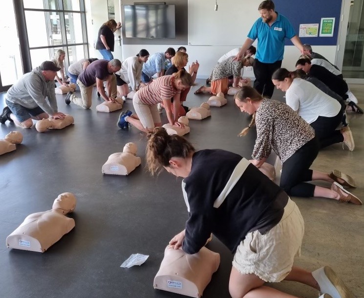 James guiding participants through hands-on CPR practice
